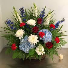 Red and white funeral flowers if you want to honor the life of a departed loved one, choosing red and white funeral flowers is a way to show both honor and reverence for the life lost, as well as lingering romantic love and respect. Red White And Blue Wicker Funeral Basket In Peabody Ma Evans Flowers