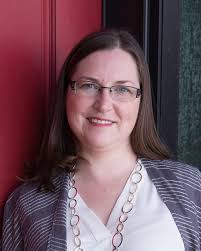 Should we buy groceries in Alberta or the US, considering the exchange  rate, when traveling to Lake Louise?