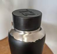 How can I strip this water bottle of the black stuff that's ...