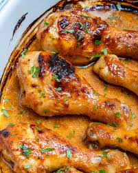 Place the coated chicken legs on the two parchment lined cookie sheets. These Honey Mustard Baked Chicken Drumsticks Are Amazing Clean Food Crush