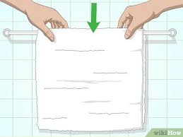 Let's just say that a bathroom without a proper towel rack or holder is a mess. 3 Ways To Arrange Towels On A Towel Bar Wikihow