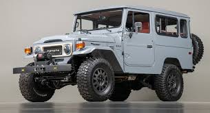 fj company s restomoded 1984 toyota land cruiser is just about perfect carscoops restomoded 1984 toyota land cruiser