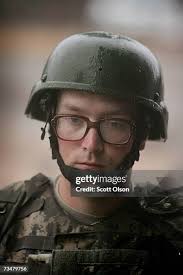 Hanna Beard of Santa Monica, California waits out the rain with other...  News Photo