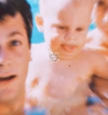 "Tony Curtis and his wife, Janet Leigh, are photographed with their  daughters, Kelly and a young Jamie Lee Curtis, at their California home in  1959."