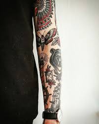 Beautiful Black And Red Traditional Tattoos On The Left Forearm Traditional Tattoo Sleeve Best Sleeve Tattoos Traditional Tattoo