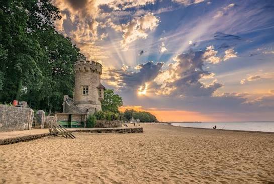 Sun lighting up the tower on Appley Beach just now. Webcam view.