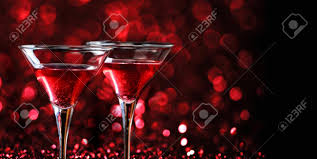 Why martini glasses have gotten out of control: Two Martini Glasses In Front Of Red Bokeh Background Luxury Stock Photo Picture And Royalty Free Image Image 152278385