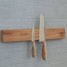 I ended up doing a standing knife block this christmas (as a gift, here's an image of the not quite finished project), and found it very interesting to experiment with the way how magnets behave and how far. Schmidt Brothers Acacia 18 Magnetic Knife Strip