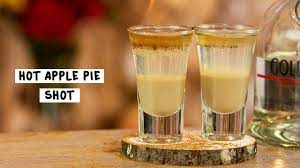 Pour irish cream into the base of a shot glass before layering on goldschläger. Hot Apple Pie Shot Tipsy Bartender