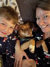 Buckey's Christmas sweater and matching human PJs