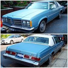 This cutlass is baby blue on the exterior and navy blue inside. 1978 Oldsmobile Delta 88