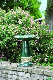 The bird and leaf motifs reveal the beige pottery beneath the glaze. Zanesville Birdbath In Juniper Green Handcrafted In Roseville Oh By Burley Clay Products Bird Bath Zanesville How To Attract Birds