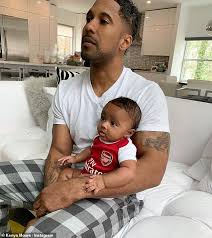 Covering the wall on the right is textured wallpaper. Kenya Moore Shares Adorable Photo Of Baby Brooklyn Wearing A Tiny Arsenal Jersey With Dad Marc Daly Daily Mail Online