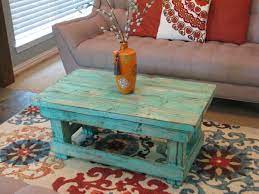 The contemporary coffee table cuts a stylish shape with its dramatically curved slim legs and chic square handles. Pretty Distressed Coffee Table Distressed Coffee Table Handmade Coffee Table Coffee Table