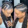 Box braids in braided bun tied to the front of the head, the braids form a voluminous chignon perfect for an evening look. 3