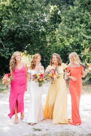 Tropical Wedding Bridal Party With Bridesmaids In Island Sunset Colors Of Coral Yell Tropical Wedding Dresses Bridal Parties Colors Wedding Bridesmaid Dresses