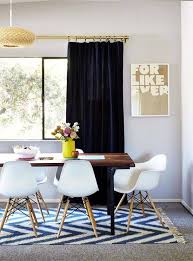 A rectangle rug in a rectangular room and/or under a rectangular table brings order to a formal dining room. 10 Ways To Style Rugs Over Wall To Wall Carpeting On Domino Com Carpet Dining Room Dining Room Rug Stylish Dining Room
