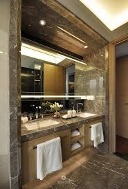 An elegant bathroom design including dark vanity, white countertops, and luxury decor accents. Elegant Interior Designs Pinterest Crackpot Baby Bathroom Design Inspiration Bathroom Design Luxury Bathroom Design