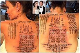 Merging two tattoo designs to one awesome masterpiece. See The Incredible Tattoos Thai Monk Gave Angelina Jolie Binding Her To Brad Pitt Culturaltattooideas Click Now Angelina Jolie Tattoo Thai Tattoo Tattoos