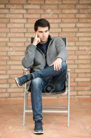If you are drawing a person from the side, your subject is likely to look unnaturally flat and stiff. Young Man Sitting In Chair In Front Of Bricks Wall Stock Photo Picture And Royalty Free Image Image 53429350