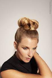 Hair Is Held Back In A Ponytail On The Top Of The Head Strands Are Interwoven To Create A Chic And Glamo Creative Hairstyles Best Hairdresser Hair Inspiration