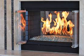 Artistic flames rise through glass media and reflect off fluted black glass. Starfire Glass Premium Fire Glass