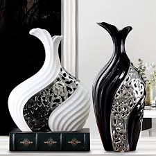 While it seems intriguing to live in such a modern living area, it will be harder for those who already have underage children. Modern Minimalist Vase Living Room Decorative Ornaments Creative Flowers Black And White Silver Vase Buy Online In Angola At Angola Desertcart Com Productid 54766347