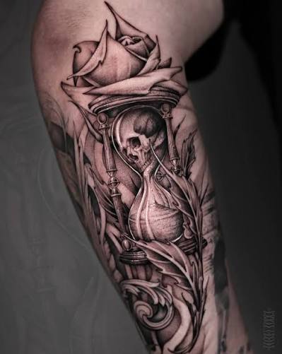 ⏳ Pensive hourglass and freehand-rose filler for Caleb; we're working on finishing his whole lower forearm, integrating this tattoo with a cherub and dove I did nearly a year ago on the
