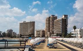 Βαρώσια) was the modern tourist area of the city of famagusta prior to the turkish invasion in 1974. Famagusta Cyprus September 15 2016 Palm Beach With Beach Umbrellas And Tourists And The Abandoned Hotels At Varosha Ghost Town Famagusta Northern Cyprus Stock Photo Picture And Royalty Free Image Image 67726872