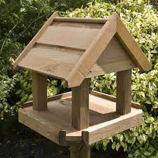Stained in a light colour, natural wood stain. Rowlinson Bisley Bird Table Garden Street
