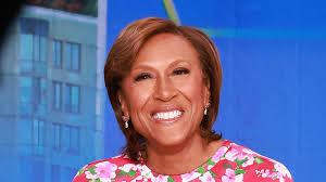 GMA's Robin Roberts insists 'I'm not trying to be sexy' to Sam Champion as  meteorologist mocks sultry detail about host