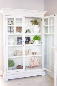 How to decorate your curio cabinet Farmhouse Style Christmas Curio Cabinet Making It In The Mountains Curio Cabinet Decor Farmhouse Style Christmas Retro Home Decor