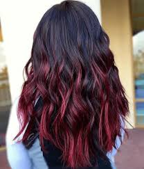 Backshot Of Woman With Burgundy Red Highlights In Her Curly Dark Hair At Salon Hair Color Burgundy Maroon Hair Ombre Hair Color