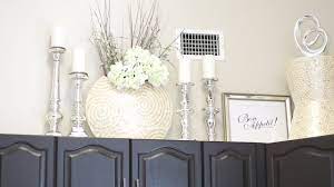 A collection of small plants above these kitchen cabinets brings a pop of color and helps freshen the air. Decorate With Me Above My Kitchen Cabinets Youtube