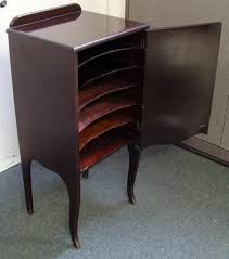 Cabinets with hand carving or original hand painting are generally worth more. Antique Wood 6 Shelf Record Sheet Music Storage Cabinet