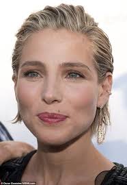 Elsa Pataky unveils rock hard abs as she promotes new fitness book