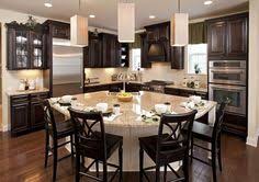 The curved quartzite island brings depth to this timeless and elegant kitchen, welcoming its guests to pull up a seat and enjoy its beauty. 20 Curved Kitchen Island Ideas Kitchen Remodel Kitchen Design Home Kitchens