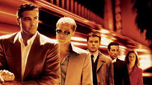 A parolee (george clooney) organizes a gang to steal $150 million from three las vegas casinos in a single heist. Ocean S Eleven An Extraordinary Plot Glide Magazine