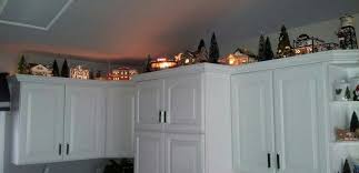 More Snow Village On Kitchen Cabinets Snow Village Christmas Village Display Above Kitchen Cabinets