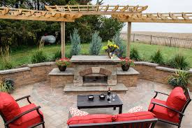 Large 22'' diameter black fire bowl holds ample fire wood to bring the crackling warmth and soothing glow of a real outdoor fire. Outdoor Fire Pits Landscaping Design Forever Green Grows Iowa City North Liberty