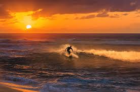 Both left and right reef breaks. Surfer Surfing On Golden Ocean Wave Sunset Time Sunset Beach Oahu Hawaii United States Photograph By Fywphoto Fyw