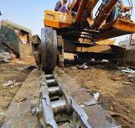 Why are chains used instead of tires in excavator machines?