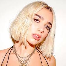 The star's custom vivienne westwood ensemble evoked the french queen's regal wardrobe, but it was her retro beauty look that really drew our attention. Dua Lipa Goes Platinum Blonde For Electricity Video Paper
