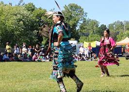Pictured here are indigenous youth dancing in jingle dresses at a powwow at piapot first nation in southern saskatchewan. National Indigenous Peoples Day