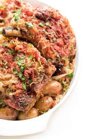Some recipes call for a couple of tablespoons of brown sugar, but i find the pork gets sweet enough from the sauerkraut. Oven Baked Pork Chops With Potatoes The Lemon Bowl
