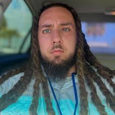 L) High-flying James Gandolfini in high school. (R) James & his son,  Michael, at a Raptors/Nets game in 2007. Michael plays Tony Soprano in the  new movie "The Many Saints of Newark'