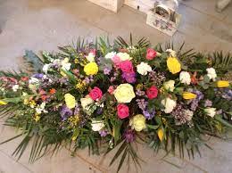 Bright And Colourful Spring Coffin Spray Casket Funeral Tribute Www Thefloralartstudio Co Uk Funeral Flowers Funeral Flower Arrangements Casket Flowers