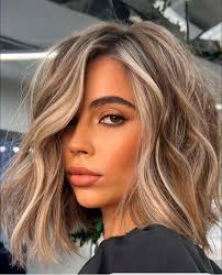 Who specializes in blonde hair styling in Klamath Falls?