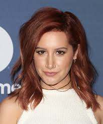 She is a fitness freak as well. Ashley Tisdale Medium Wavy Dark Burgundy Red Hairstyle