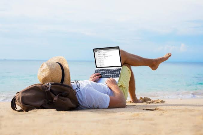Business owner managing responsibilities before taking time away from the business